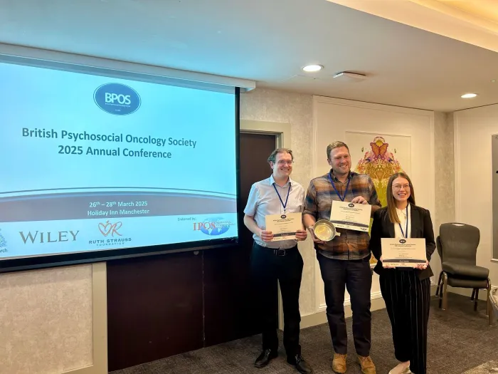 James Rathbone receiving the best presentation award at the The British Psychosocial Oncology Society (BPOS) annual conference