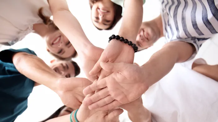 People putting hands together